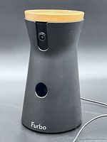 Front view of Furbo Max dispenser showing camera lens, treat port and Furbo logo