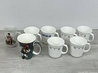 All eight mugs grouped to show variety and quantity