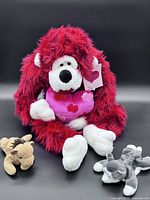 Group shot of all three plush toys