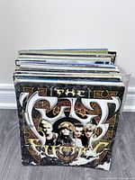 Stack of LPs fronted by The Cult "Electric" album