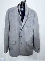 Full view of Michael Kors grey wool blend coat on hanger