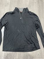 Full view of black Michael Kors quarter-zip sweater