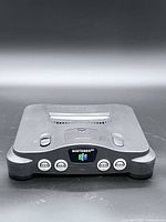 Front view of Nintendo 64 console showing ports and logo