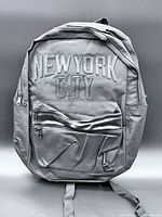 Front view showing embroidery, pocket, zippers