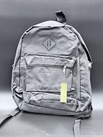 Front view showing diamond lash-tab, front pocket, tag, scuff