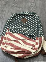 Front view showing stars and stripes pattern and front pocket