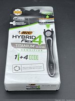 Front of sealed Bic Hybrid Flex4 Titanium Sensitive razor package