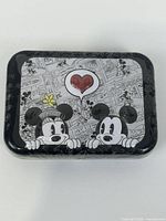 Top view of sealed Mickey & Minnie comic tin