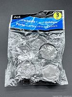 Front view of sealed Jot 3-piece retractable card holders pack