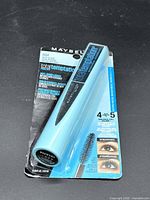 Front view of sealed Maybelline Total Temptation mascara package