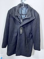 Overcoat front view with tag attached