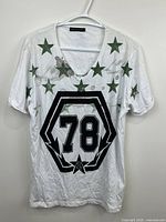 Front view of entire T-shirt showing design and condition