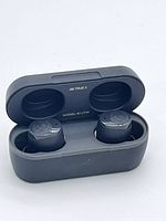 Earbuds seated in open charging case showing model inside lid