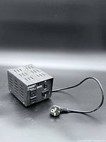 Full view of transformer with attached cord and European plug