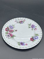 Front view of Royal Albert March plate showing full floral pattern