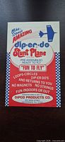 Front of Dip-er-do Stunt Plane sleeve showing branding and graphics