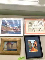 All four framed artworks hung together
