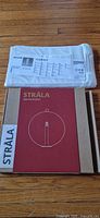 STRÅLA boxed ornament with SKUBB packaged organizer