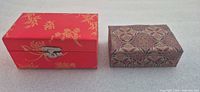 Both brocade boxes side by side closed