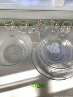 overview of all pressed glass pieces and gold-rim glasses