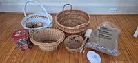 Group shot of all baskets, tin, ornaments, wood bowl, twine spool, scratch mat, bath pad