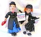 Front view of both Mary Poppins and Bert plush dolls standing together with tags visible