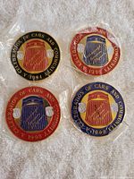 All four sealed medallions showing dates and color variations