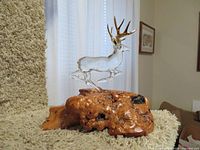 Full side view of glass buck on burl base