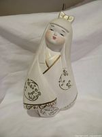 Full front view of Hakata clay doll showing painted details