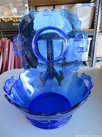 Platter standing upright behind matching bowl on table
