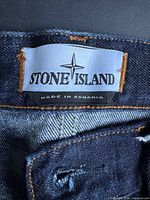Stone Island brand label showing 'Made in Romania'
