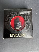 Front of Shure Encore box showing cartridge through window