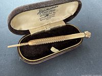 Pencil fully extended resting in open Bravingtons case