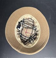 Interior view showing Burberry label, plaid lining, inner brim