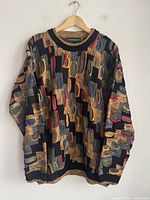 Front view of multicolour textured Tundra sweater on hanger