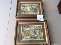 Two framed 3D shadow box Anton Pieck art prints showing detailed scenes in wood frames with gold borders