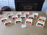 All 13 Lledo Canadian Provincial Series 1920 Model T cars in original boxes arranged on a table.