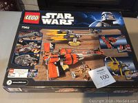 Front of box displaying LEGO Star Wars set 7962 with images of two podracers and minifigures