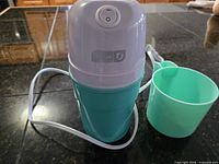 Full assembled unit with extra cup visible