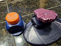 Both paper punches side by side for scale comparison