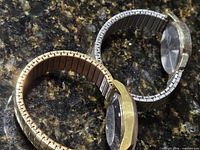 Both watches side by side showing cases, dials, bands