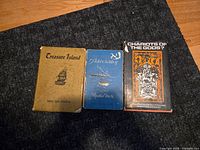 Front view of all three books side-by-side