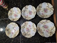 six ornate dessert dishes front view