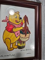 Full view of framed Winnie the Pooh straw mosaic