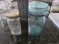Kraft jar beside Atlas aqua canning jar, ruler for scale