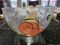 Side view showing painted pumpkin and leaf detail on crackle glass surface