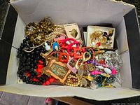 Overview of full box with assorted jewellery pieces