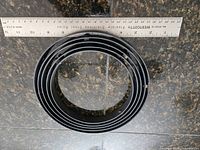 Nested metal rings beside ruler showing ~12 in diameter
