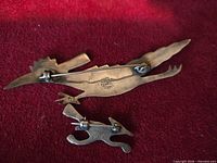 Backs of both sterling roadrunner brooches showing clasps and Mexico 925 stamp