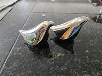 Full pair of bird shakers side profile on countertop